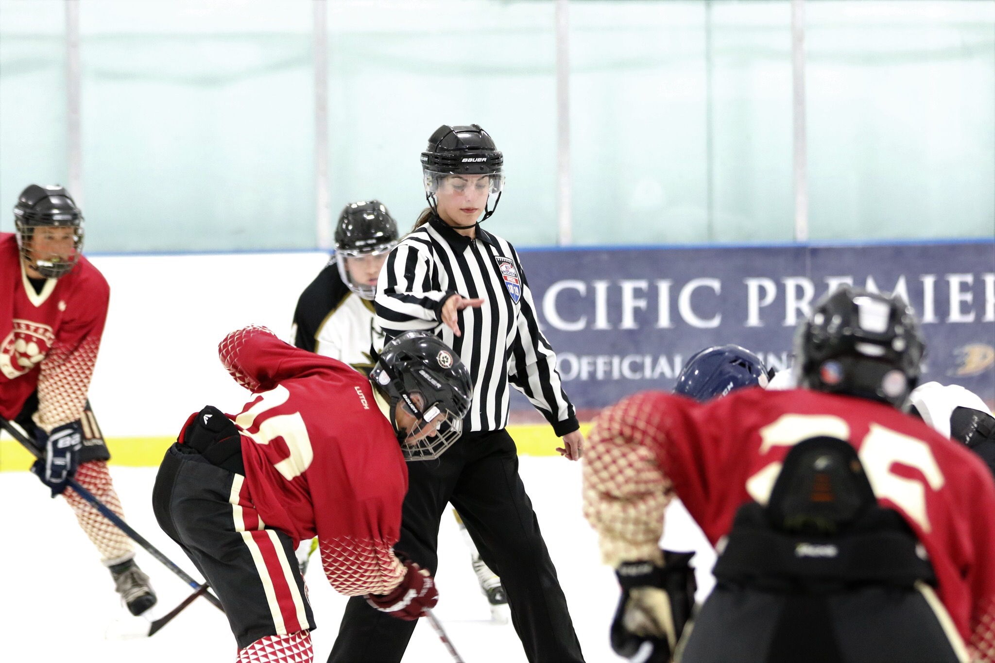 Me taking a center ice faceoff and dropping the puck for a highschool ice hockey game